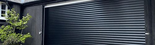 Garolla black garage door wooden frame